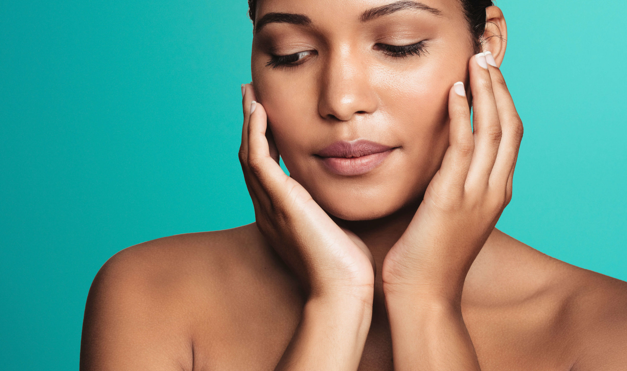 XERF radiofrequency skin tightening London - close-up of a woman framing her face Close-up of a woman framing her face with both hands, XERF radiofrequency skin tightening London